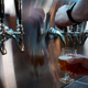 hand pouring beer from tap